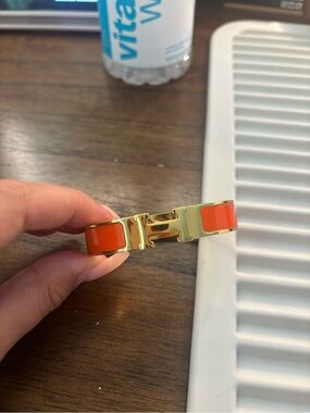 Hermes Orange and Gold Enamel Clic H Bracelet
